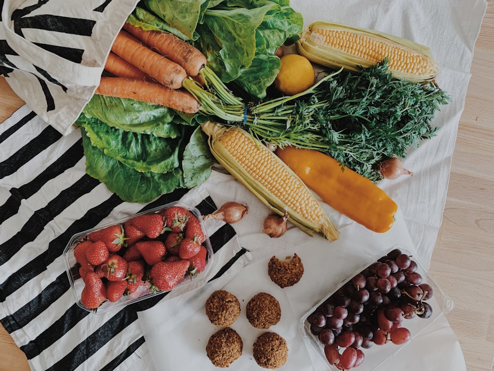 carrots and corn on brown wooden table