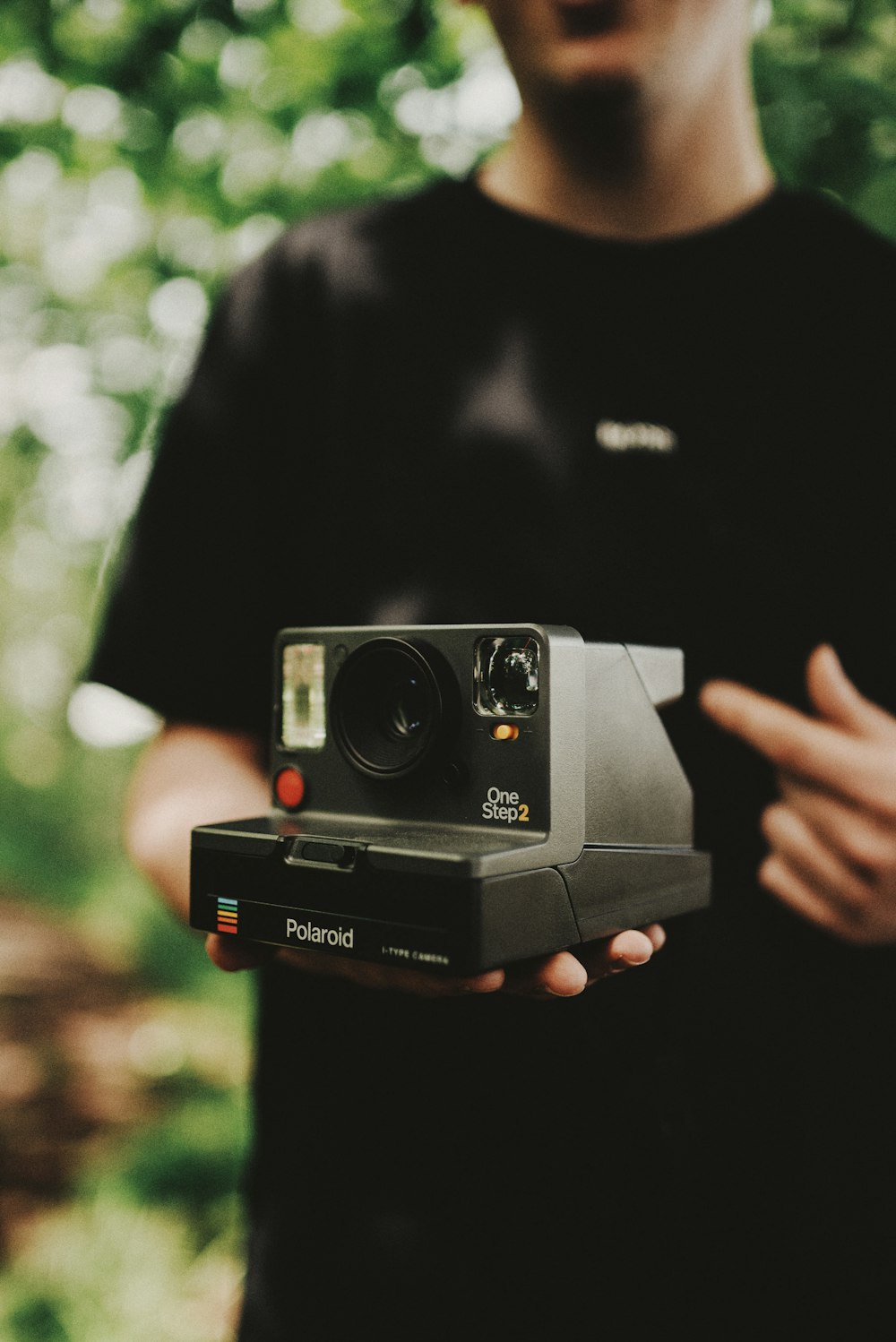 black and red polaroid camera