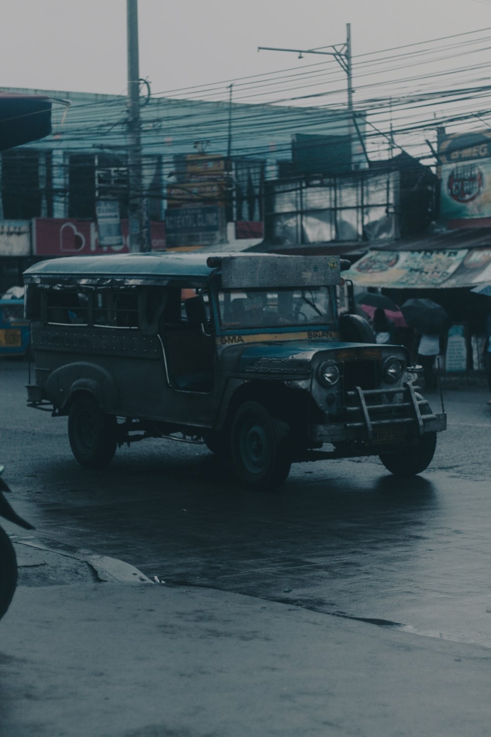 black suv parked on street during daytime