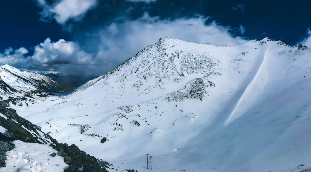 snow covered mountain under blue sky during daytime