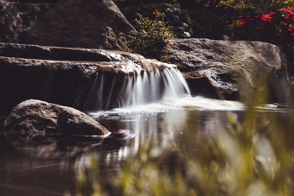 time lapse photography of water falls