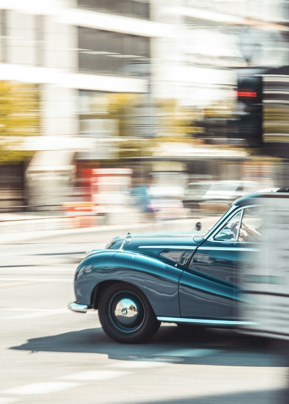 blue car on road during daytime