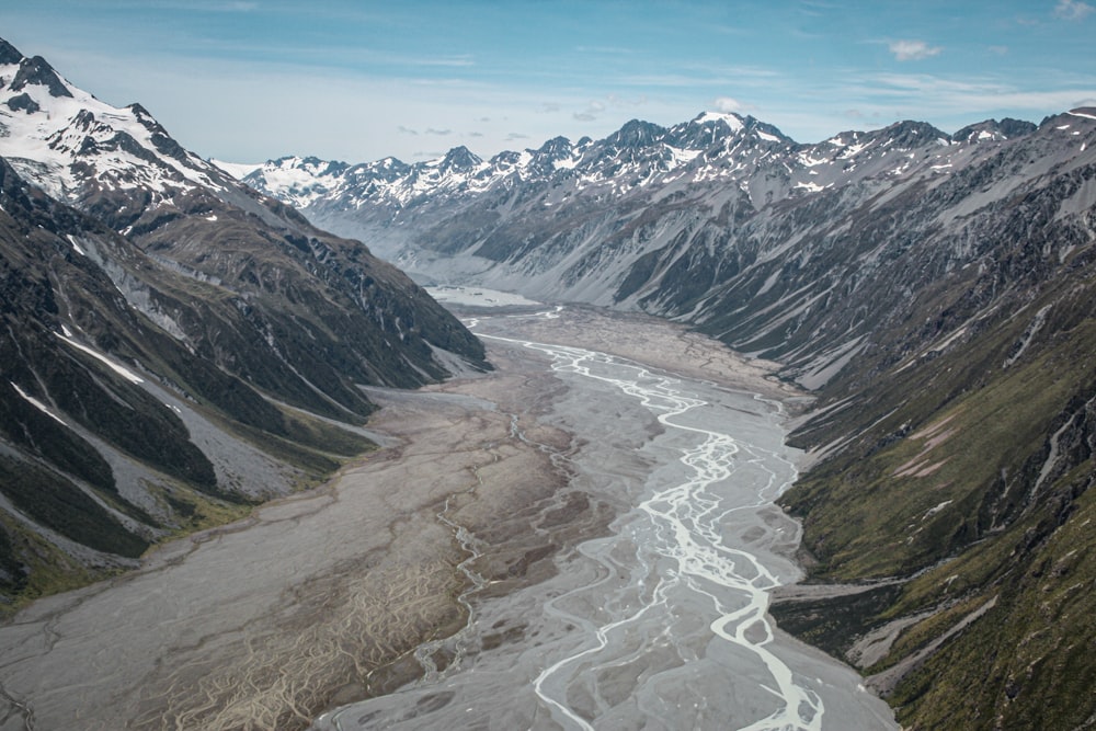 gray and white mountains under white sky during daytime