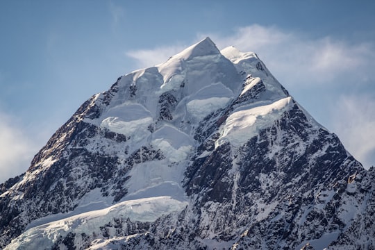 snow covered mountain under blue sky during daytime in Aoraki/Mount Cook New Zealand