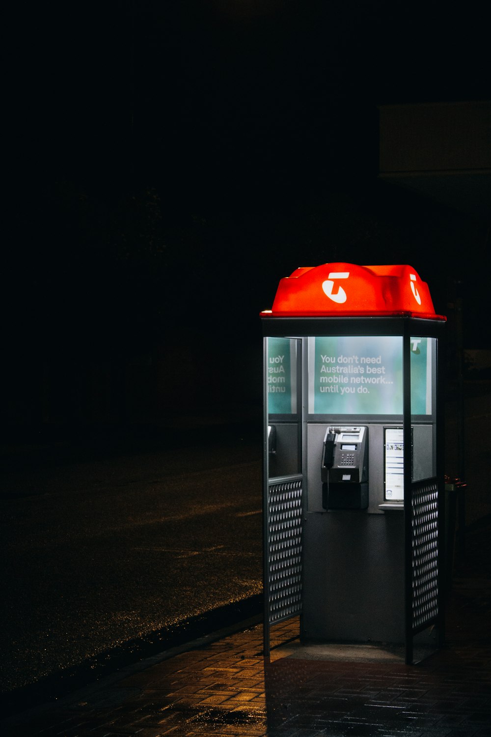 red and black telephone booth