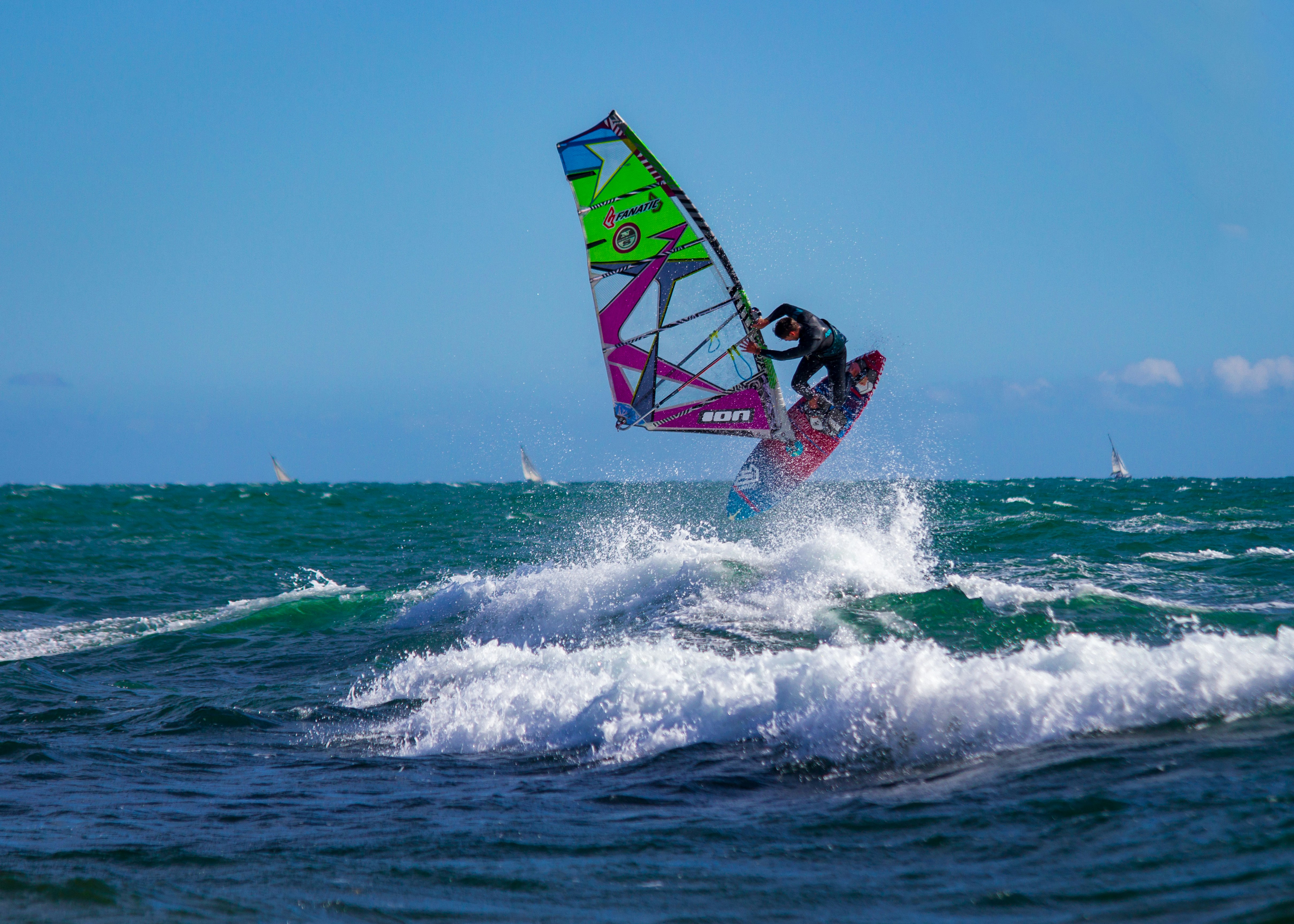 A jump in windsurf on the French Riviera. It's a sunny day without clouds. Sky and Sea are blue !