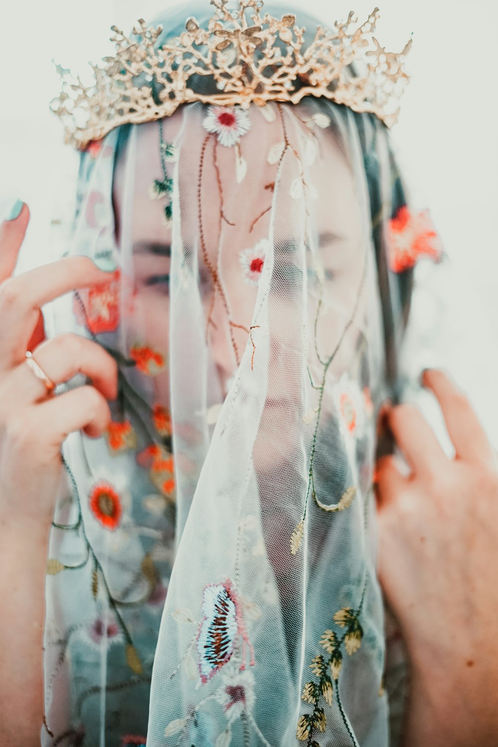 woman in white red and green floral dress