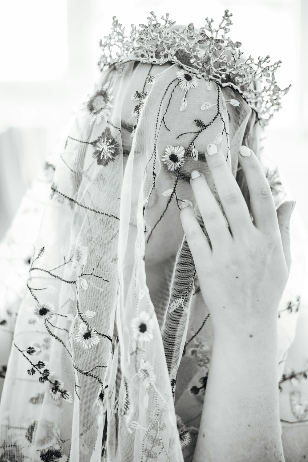 woman in white floral dress with white flower headdress