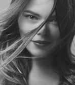 A close-up portrait of Blanca Reygal with a warm, confident expression.