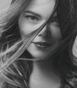 A close-up portrait of a confident actress ready for her close-up under studio lights.