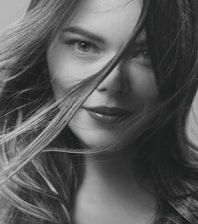 A tasteful, artistic close-up of a confident young woman expressing freedom and sensuality.