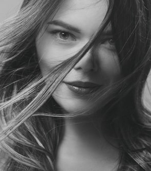 A close-up portrait of a confident actress ready for her close-up under studio lights.