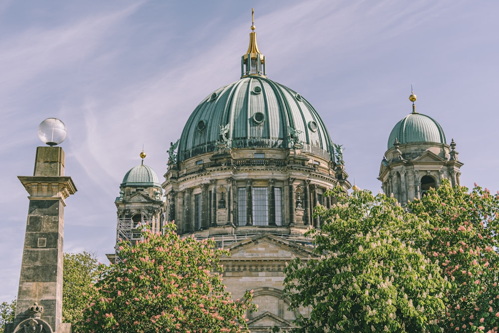 gray concrete dome building under blue sky during daytime