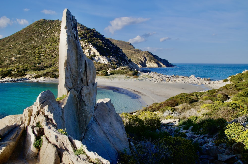 gray rock formation on seashore during daytime