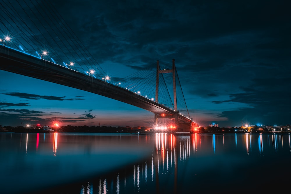 bridge over body of water during night time