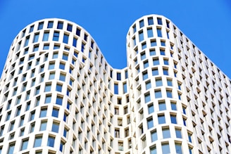 white and blue concrete building under blue sky during daytime