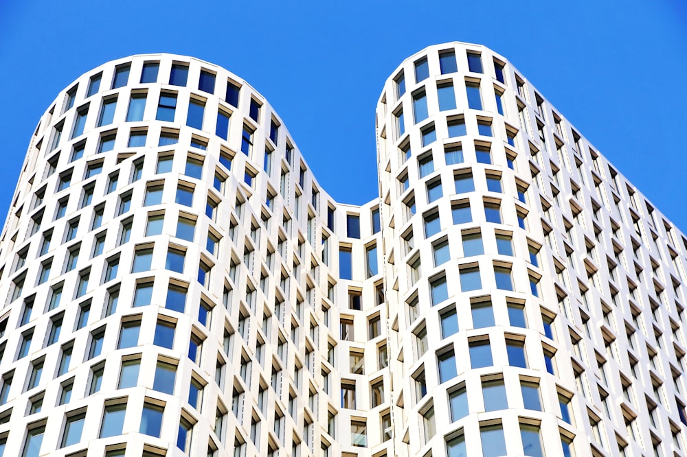 white and blue concrete building under blue sky during daytime