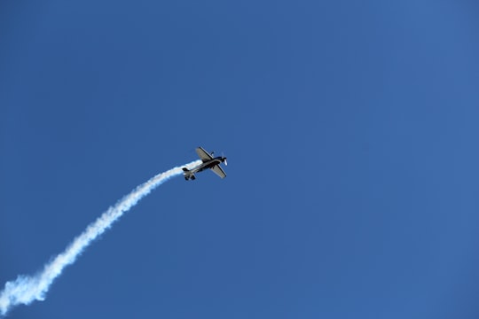 white airplane in mid air during daytime in Bento Gonçalves Brasil