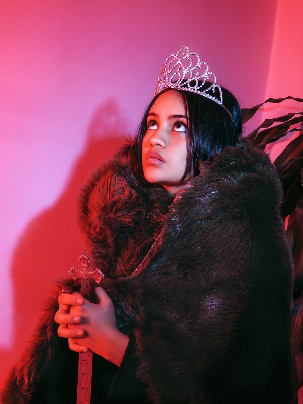 woman in black fur coat wearing silver crown