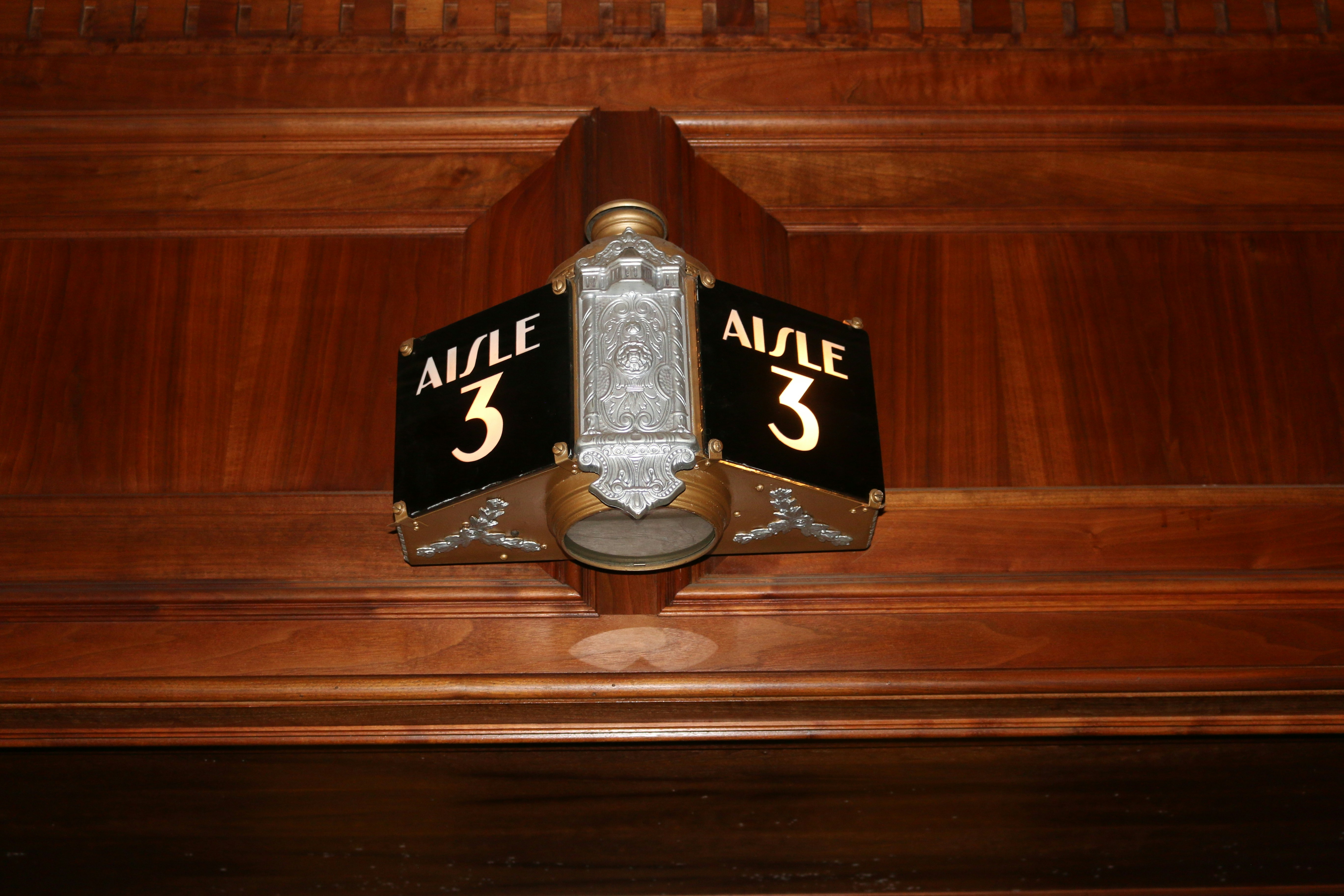 a wooden wall with a plaque on it