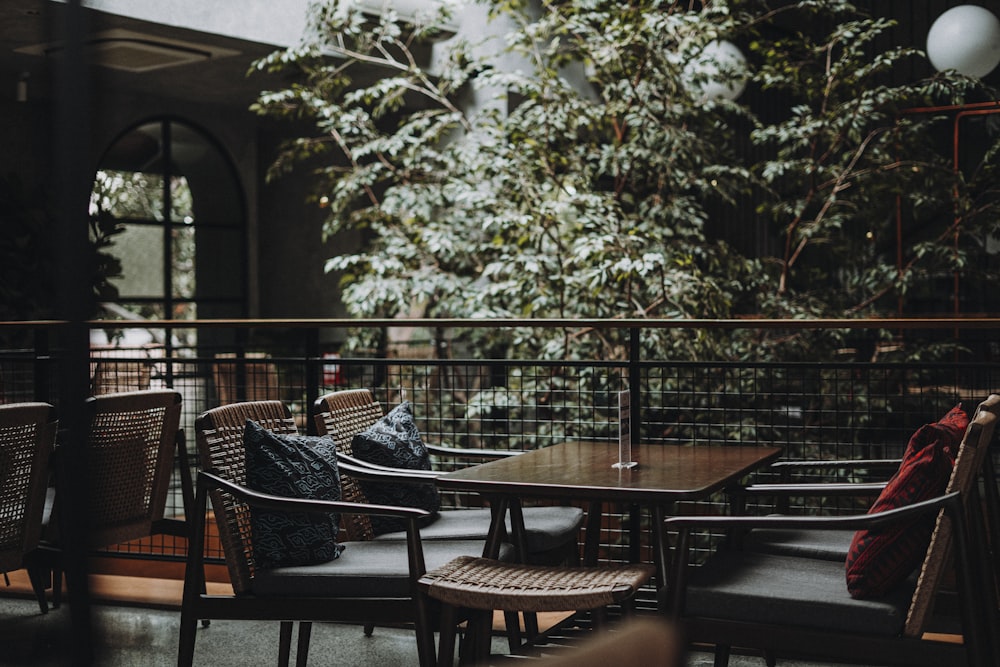 brown wooden table with chairs