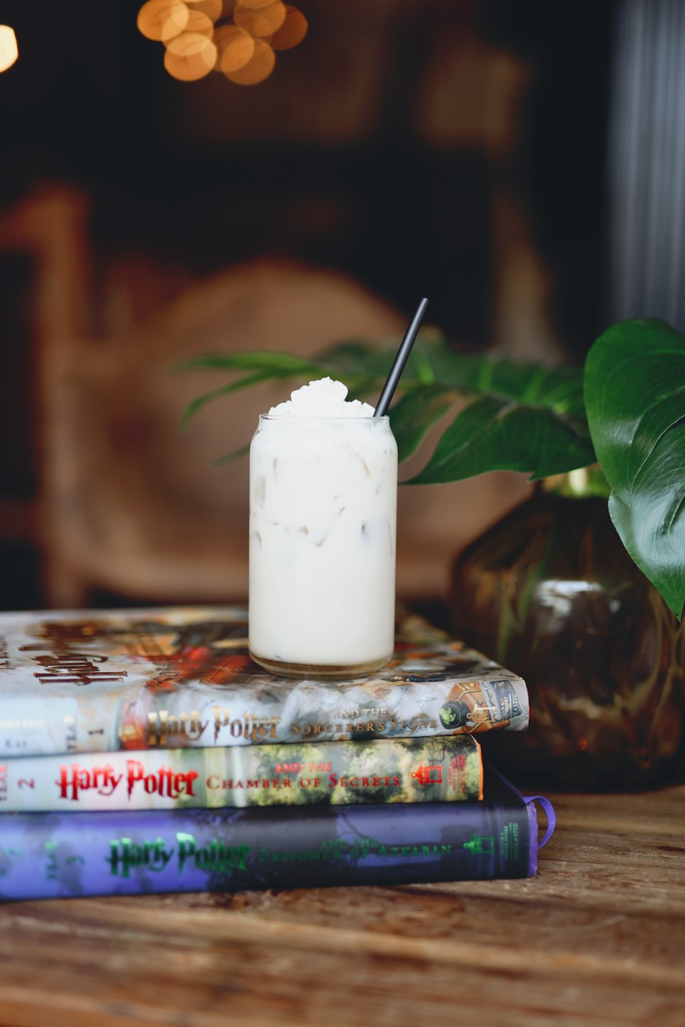 white pillar candle on white and green floral ceramic plate