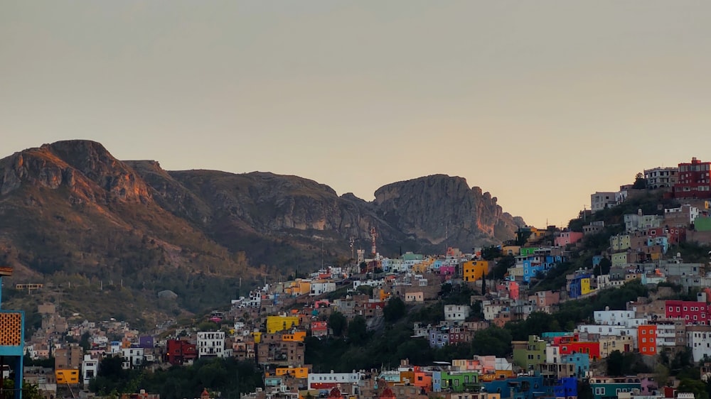 city near mountain during daytime