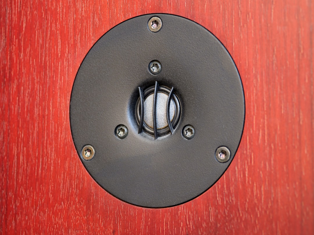 black round metal on red textile