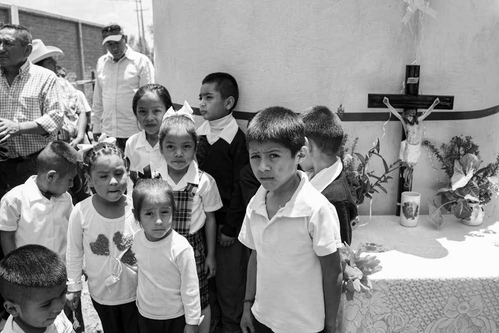 grayscale photo of children standing