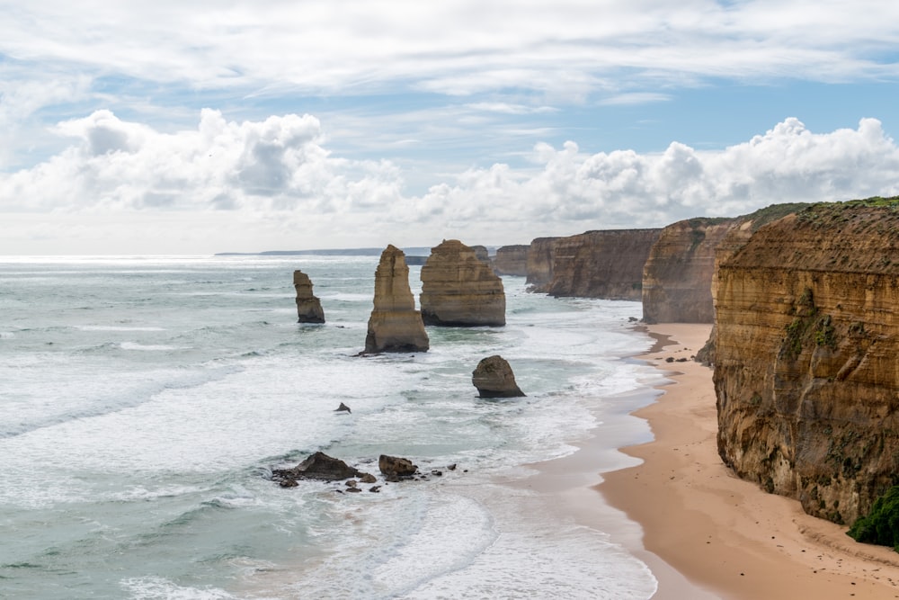 brown rock formation on sea shore during daytime