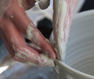 person holding white ceramic bowl