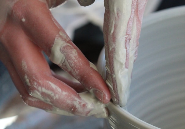 person holding white ceramic bowl