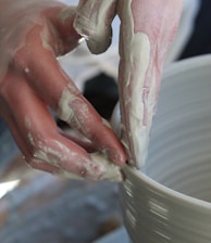 person holding white ceramic bowl