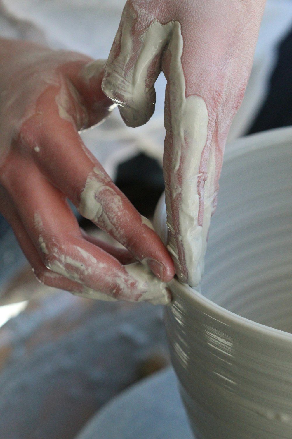 person holding white ceramic bowl