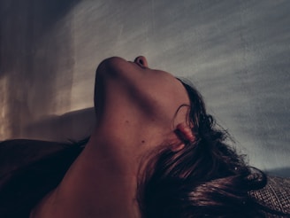 Side profile of a patient undergoing a non-invasive neck tightening procedure.