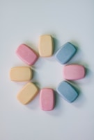 A neat row of soaps in soft sky blue and white tones, each with unique swirling patterns resembling clouds.