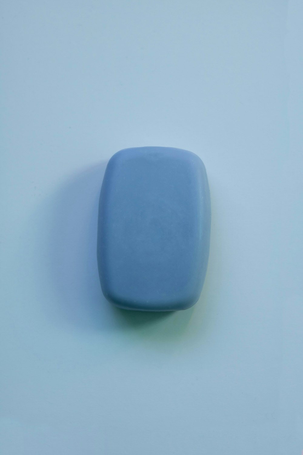 blue plastic container on white table