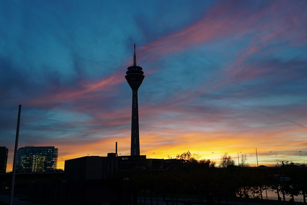 silhouette of building during sunset