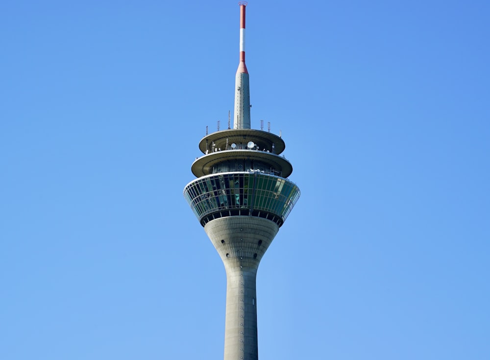 green and white concrete tower under blue sky during daytime