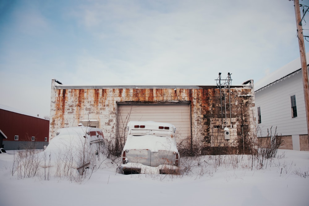 white van on snow covered ground during daytime