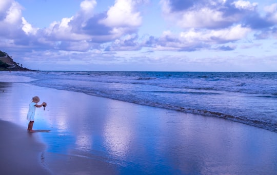 blue sea under blue sky and white clouds during daytime in Port Douglas QLD Australia