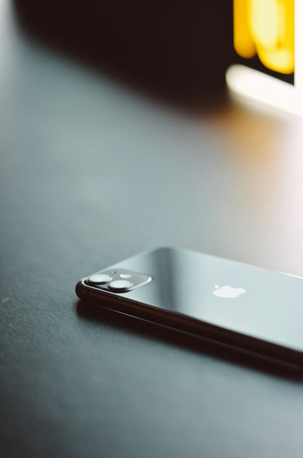 silver iphone 6 on black table