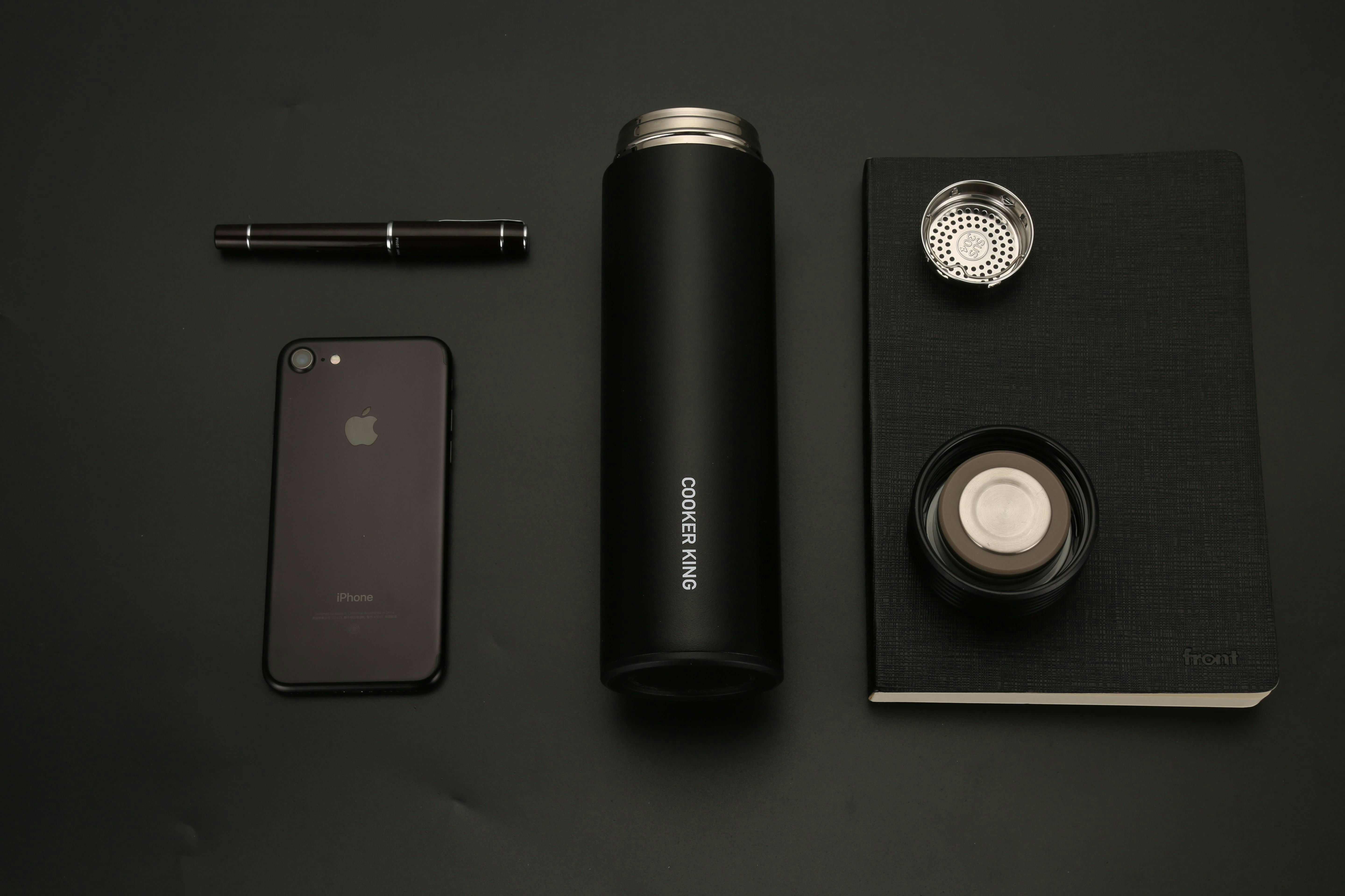 black iphone 7 beside black and silver camera lens