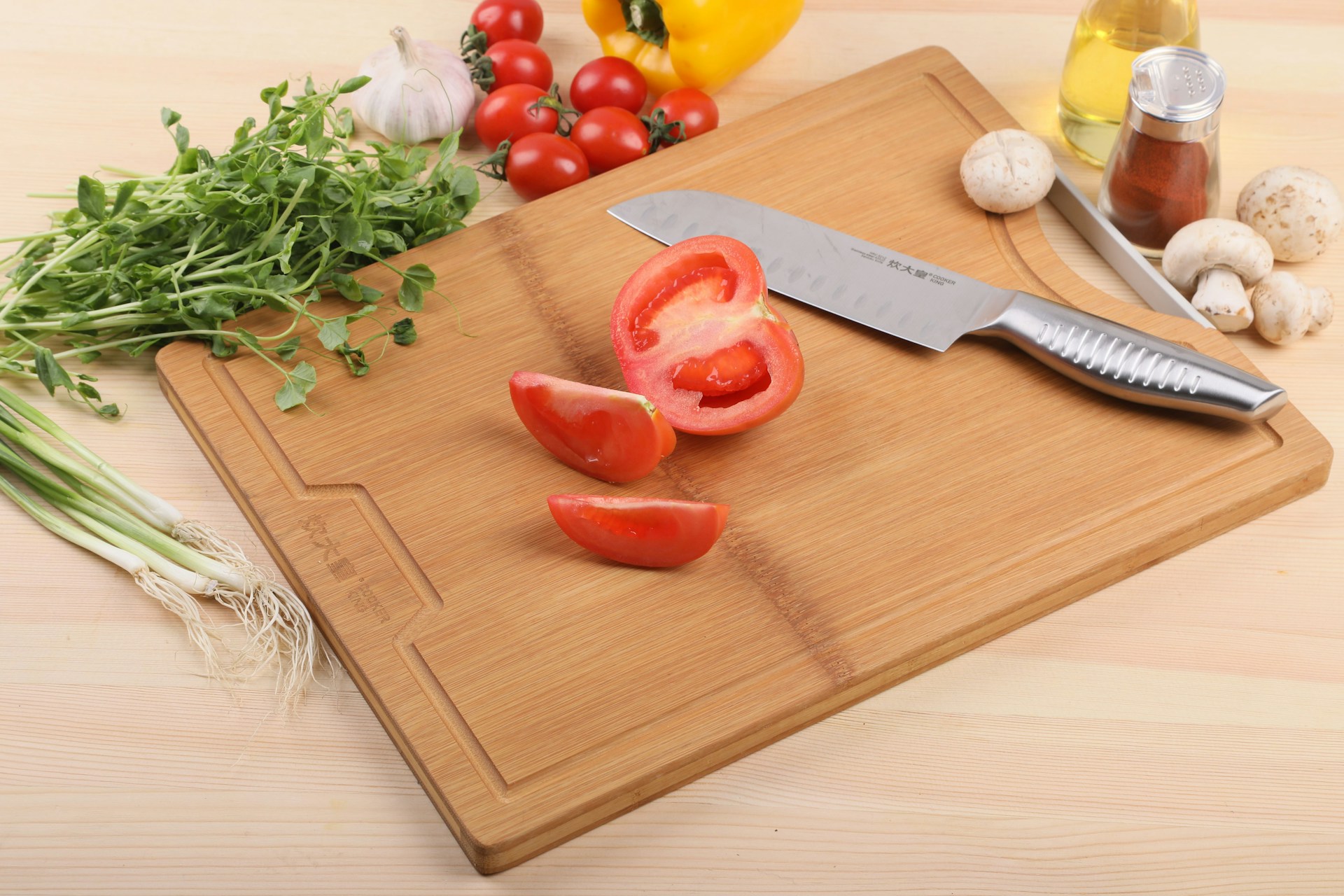 red tomato on brown wooden chopping board