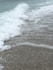 ocean waves crashing on shore during daytime