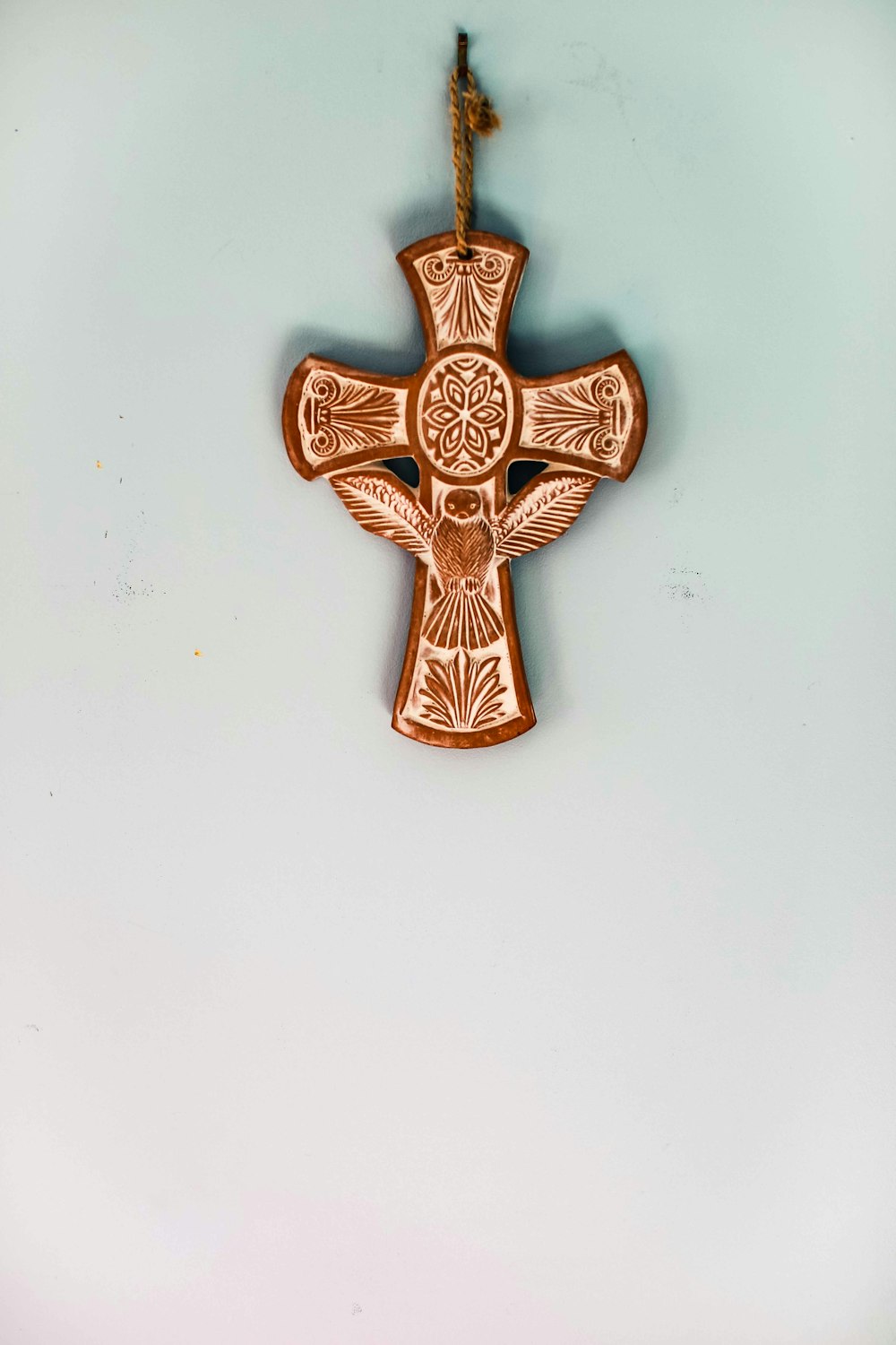 gold cross on white wall