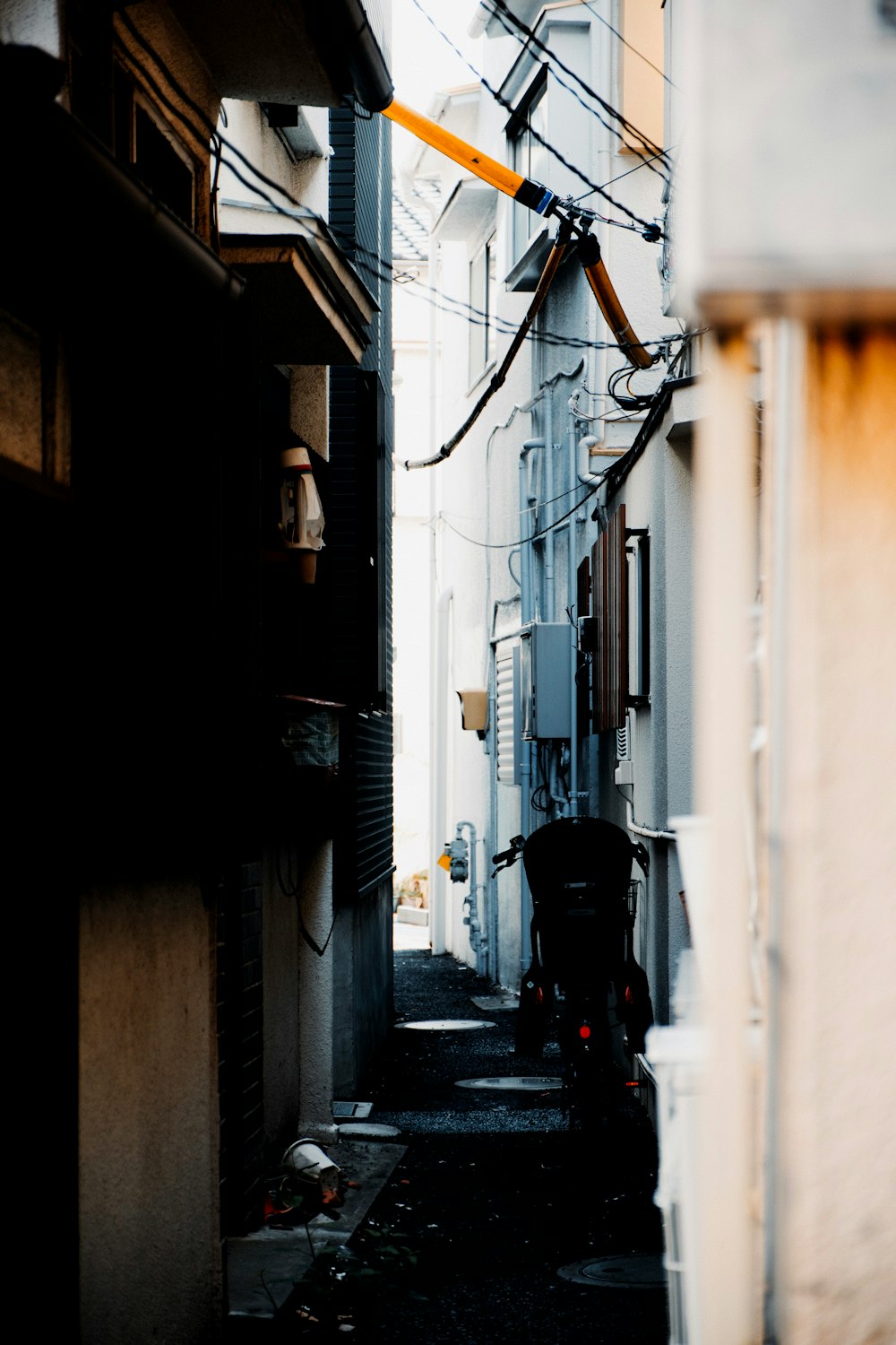 man in black jacket walking on street during daytime