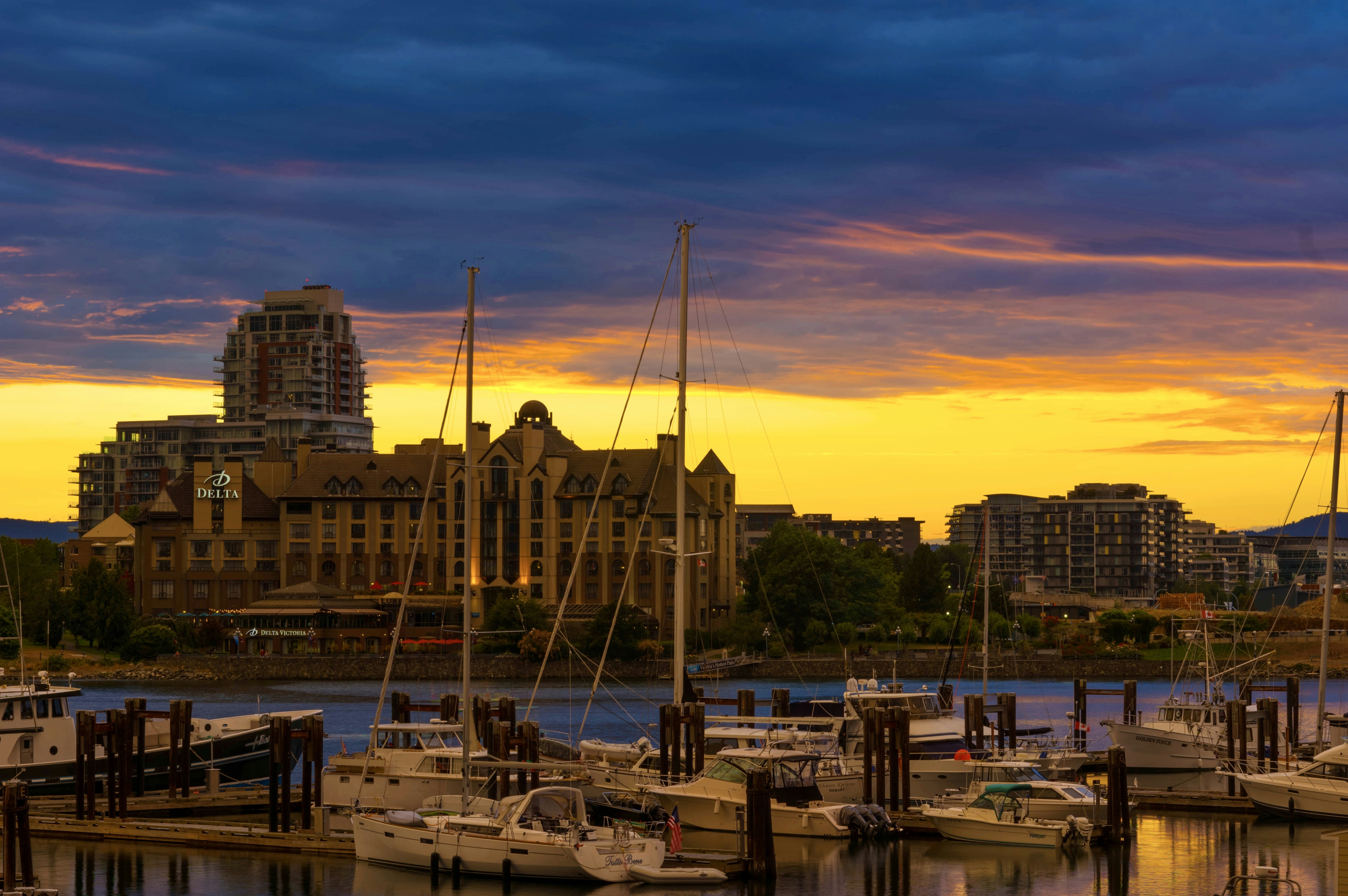 white boat on dock during sunset