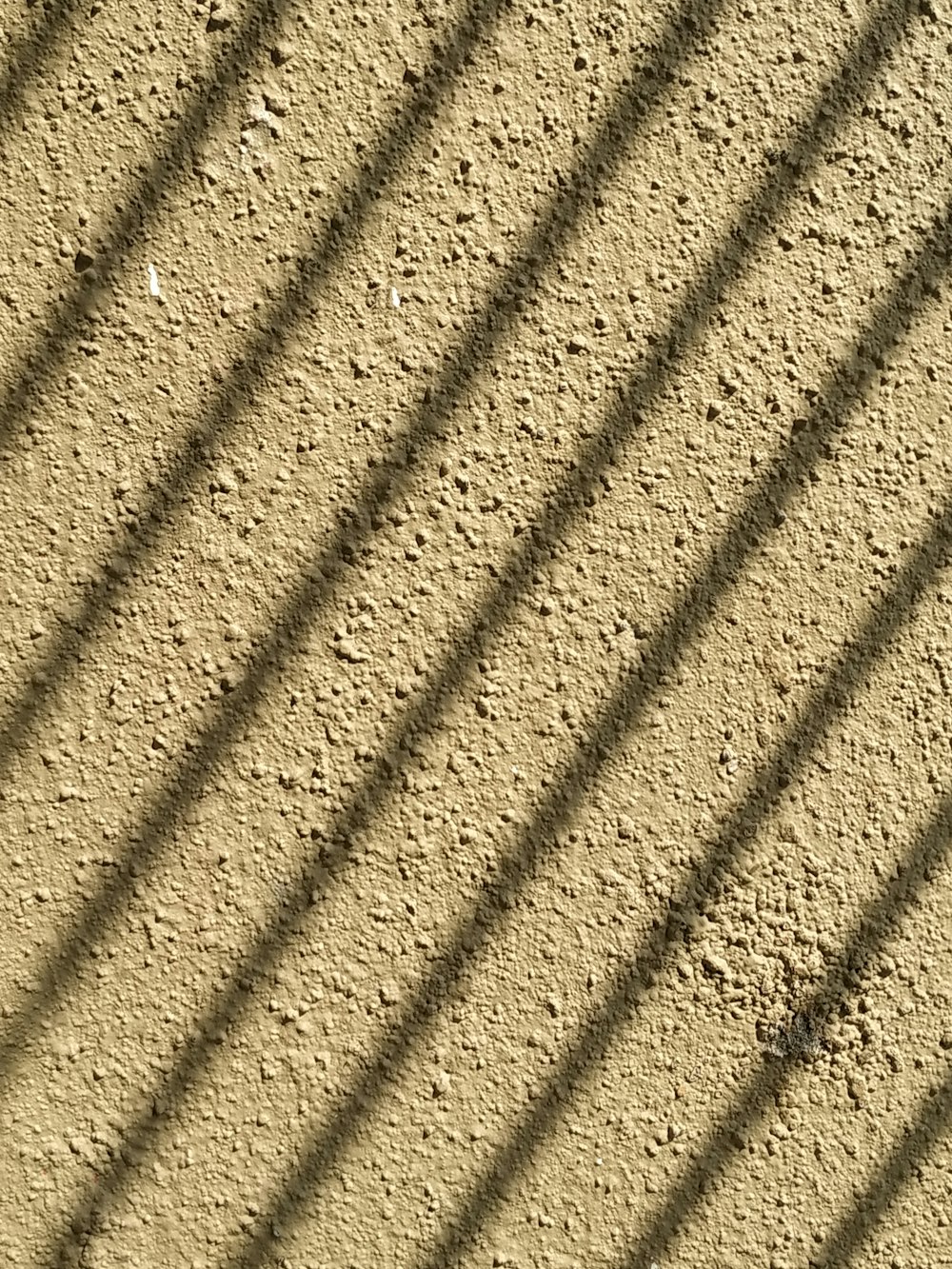 brown sand with shadow of person