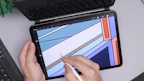 Close-up of hands designing a colorful Canva template on a tablet.